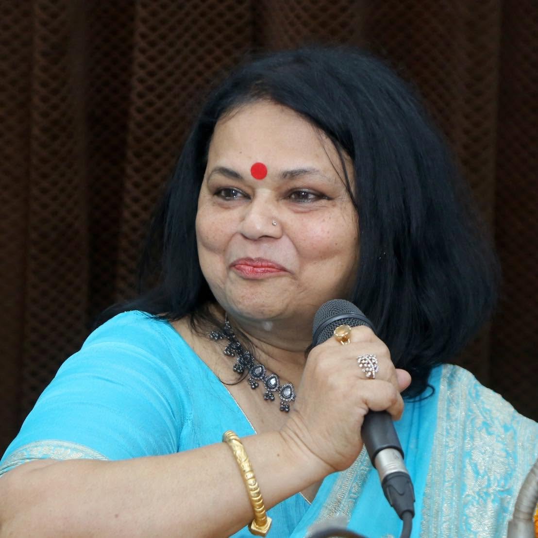 Dr. Meenu Khare speaking at an event